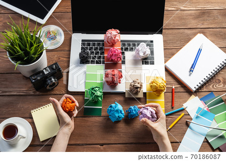 Close up woman hands with colorful paper balls Close up woman hands with colorful paper balls 70186087