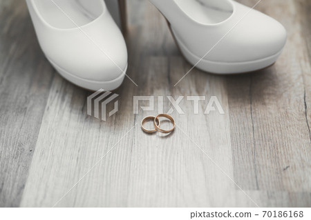 White stylish wedding shoes for bride. Close-up 70186168