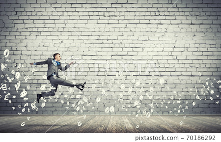 Businessman jumping high Businessman jumping high 70186292