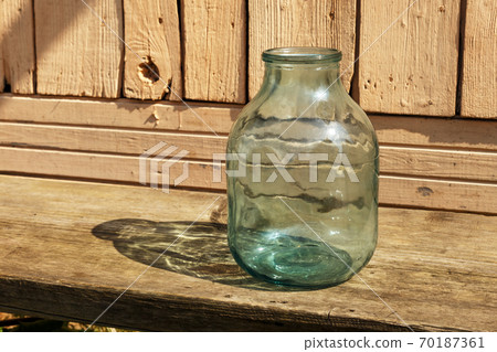 Empty glass jar. 70187361