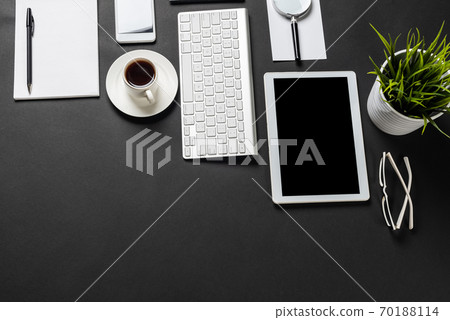Top view of workplace with digital devices Top view of workplace with digital devices 70188114