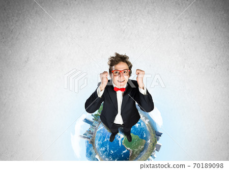Businessman on Earth globe Businessman on Earth globe 70189098