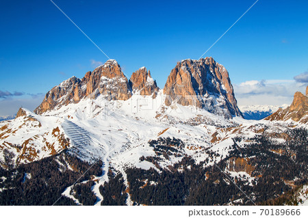 Italian Dolomites mountains Fassa Valley Sassolungo with the peaks Spallone, Punta Grohmann and Cinque Dita Italian Dolomites mountains Fassa Valley Sassolungo with the peaks Spallone, Punta Grohmann and Cinque Dita 70189666