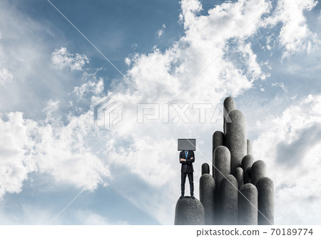 Businessman with TV instead of head. 70189774
