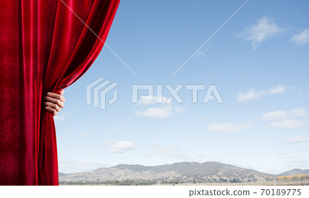 Summer natural bluesky view behind red velvet curtain 70189775