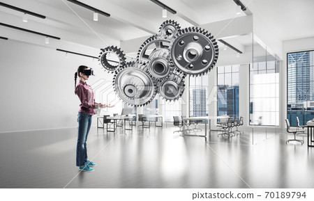 Virtual reality concept and mechanism of engine in modern interior. Mixed media Virtual reality concept and mechanism of engine in modern interior. Mixed media 70189794