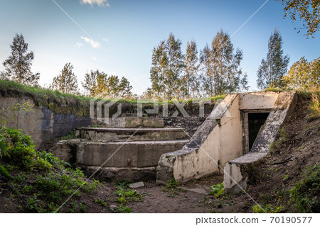Russia. Leningrad region. Grey horse Fort. The entrance to the defenses of battery 332 and the preserved carriage for Vickers guns. Russia. Leningrad region. Grey horse Fort. The entrance to the defenses of battery 332 and the preserved carriage for Vickers guns. 70190577