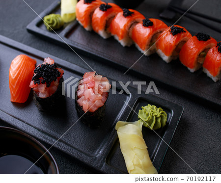 Seafood delicatessen sushi rolls set on plates 70192117
