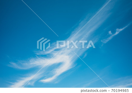 Streak clouds extending in the autumn blue sky Light tone High contrast Streak clouds extending in the autumn blue sky Light tone High contrast 70194985