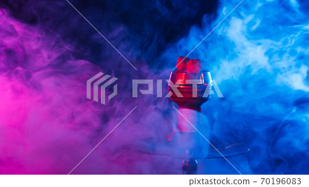 hookah red hot coals for shisha in a bowl against a background of smoke 70196083