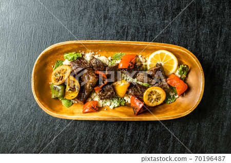 Shish kebab and couscous dishes 70196487