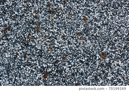 Close-up - gray-brown stone wall in the old facade of the house Close-up - gray-brown stone wall in the old facade of the house 70199169
