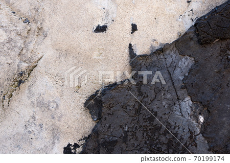 Close-up - gray-brown stone wall in the old facade of the house 70199174