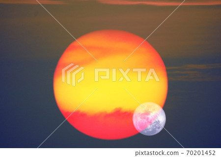 beautiful full moon on night sky and reflection close up to red yelllow sunset on glass of window 70201452