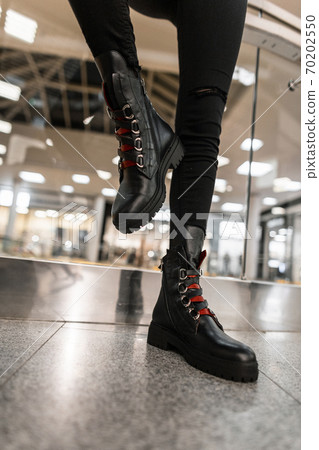 Close up of female legs in black jeans in Close up of female legs in black jeans in 70202550