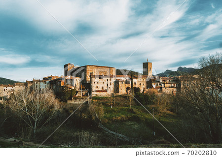 A cityscape of the medieval village of Santa Pau 70202810