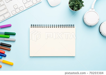 Top view with copy space of office desk with accessories 70203384