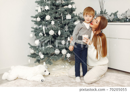 Mother with son in a Christmass decorations Mother with son in a Christmass decorations 70205055