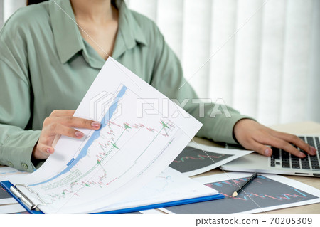Trader businesswoman analyze stock graph and report, set targets for online forex trading market management success Trader businesswoman analyze stock graph and report, set targets for online forex trading market management success 70205309