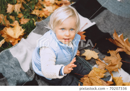Autumn portrait of cute blond child. 70207336