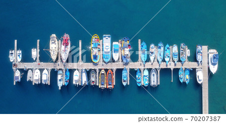 Panoramic Aerial view on boats moored in the pier, drone shot directly above.  70207387