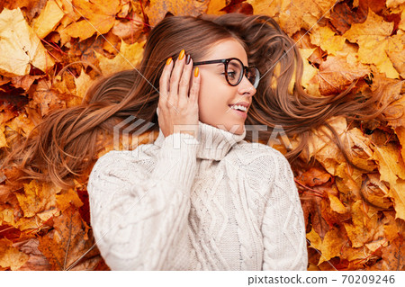 Positive young woman with a beautiful smile in Positive young woman with a beautiful smile in 70209246