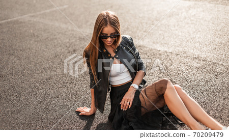 Attractive happy young hipster woman with a Attractive happy young hipster woman with a 70209479