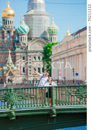 Family at the summer waterfront in Saint Petersburg outdoors 70211310