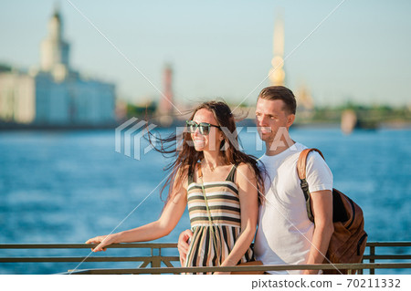 Coulpe at the summer waterfront in Saint Petersburg 70211332