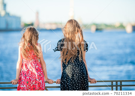 Children at the summer waterfront in Saint Petersburg Children at the summer waterfront in Saint Petersburg 70211334