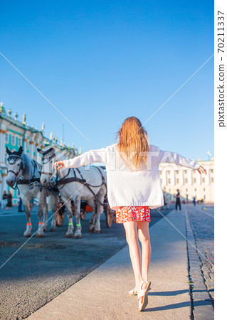 Little girl visiting the Hermitage in Saint-Petersburg. Little girl visiting the Hermitage in Saint-Petersburg. 70211337