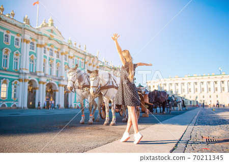 Little girl visiting the Hermitage in Saint-Petersburg. Little girl visiting the Hermitage in Saint-Petersburg. 70211345