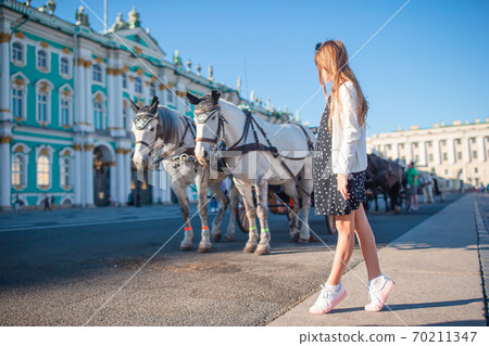 Little girl visiting the Hermitage in Saint-Petersburg. Little girl visiting the Hermitage in Saint-Petersburg. 70211347