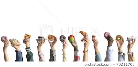 People are holding different desserts in their hands. The concept of food and sweets. People are holding different desserts in their hands. The concept of food and sweets. 70211705