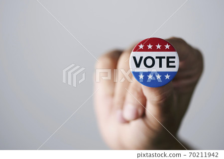 man with a vote badge for the US election 70211942