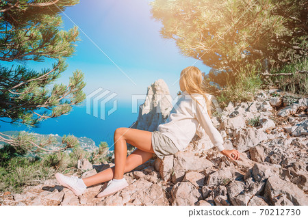 Little kid on edge of cliff in mountains Little kid on edge of cliff in mountains 70212730