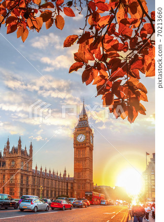 Big Ben against colorful sunset with autumn leaves in London, England 70213660