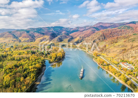 Panorama of Wachau valley with ship on Danube river during autumn in Austria Panorama of Wachau valley with ship on Danube river during autumn in Austria 70213670