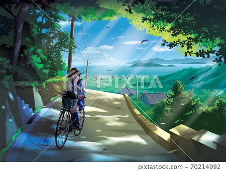 Japanese girl student rides a bicycle on a road in the countryside 70214992