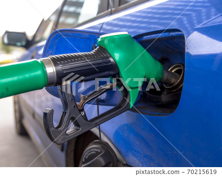 Car refueling at gas station 70215619