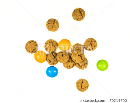 Bunch of scattered pepernoten cookies and sweets Bunch of scattered pepernoten cookies and sweets 70215700