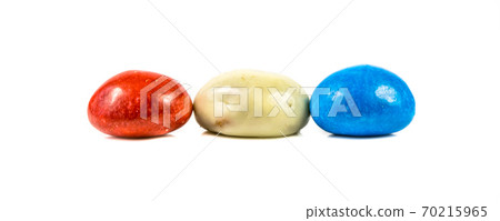 Pepernoten bunch of colored cookies in dutch flag colors on white background 70215965