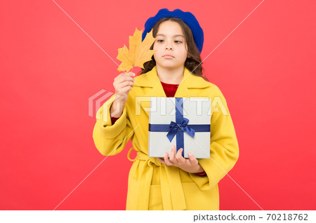 thanksgiving day. girl child in french beret hold gift thanksgiving day. girl child in french beret hold gift 70218762