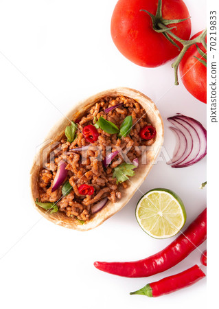 Mexican barquita taco with beef, chilli, tomato, onion and spices isolated on white background.  70219833