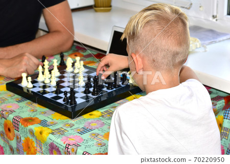 The boy thought about the chessboard. 70220950
