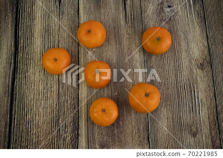 Tangerine, Mandarin honey orange on the wooden background. Food concept. Tangerine, Mandarin honey orange on the wooden background. Food concept. 70221985