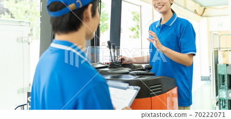 Female driver driving a forklift 70222071