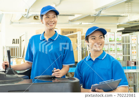 Female driver driving a forklift 70222081