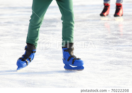 legs in blue skating on the ice rink legs in blue skating on the ice rink 70222208