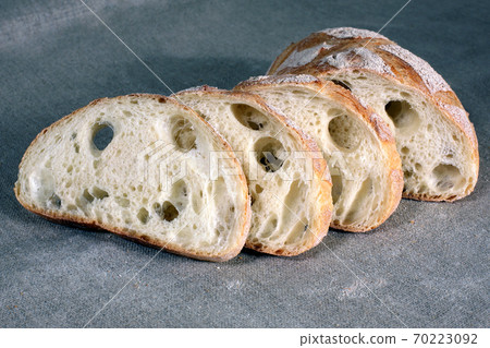 sliced white bread on the tablecloth is made of linen sliced white bread on the tablecloth is made of linen 70223092